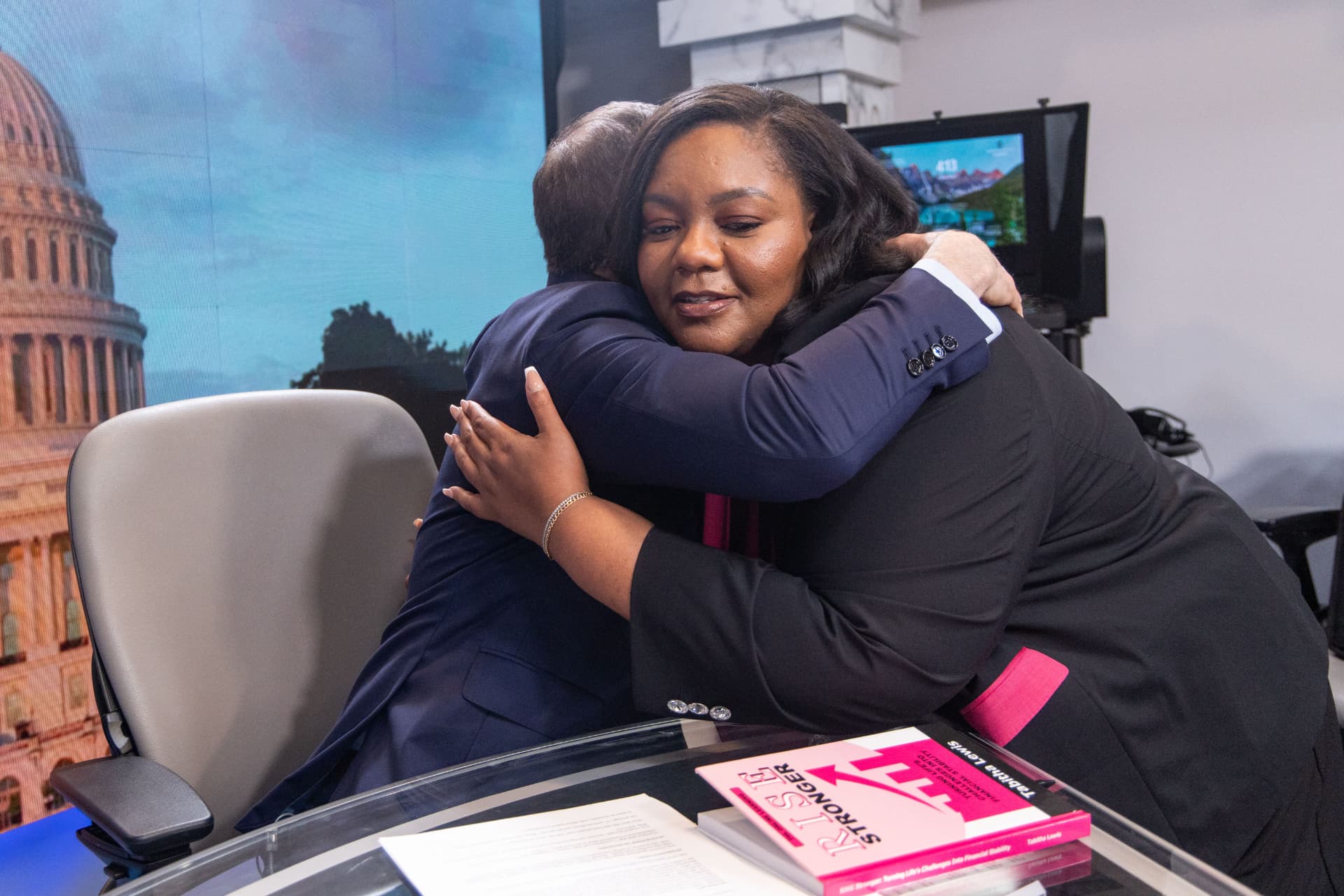 A Media Mastery participant embracing Mark Albert after a studio session